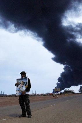 A Gaddafi supporter near Ras Lanuf. The Libyan government took journalists to the area.