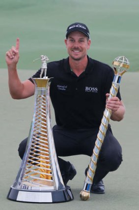 Henrik Stenson of Sweden poses with the Race To Dubai trophy.