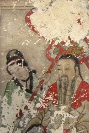One of the original ancient frescos now covered by cartoon-like paintings in Yunjie Temple in Chaoyang.