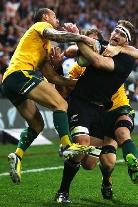 Unstoppable: All Black Kieran Read thunders towards the line against the Wallabies.