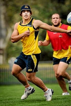 Brumbies player Matt Toomua gets a pass away  during a training session yesterday.
