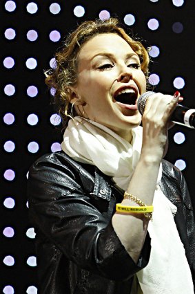 Kylie Minogue entertains the crowd at the MCG with a sing-a-long version of <i>I Still Call Australia Home</i>.