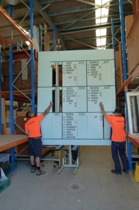 A section of the massive national tally board goes into storage.