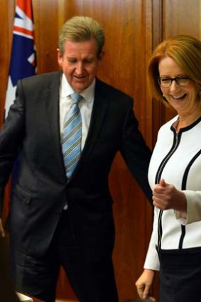 Strange bedfellows: Barry O'Farrell and Julia Gillard after signing the funding agreement.