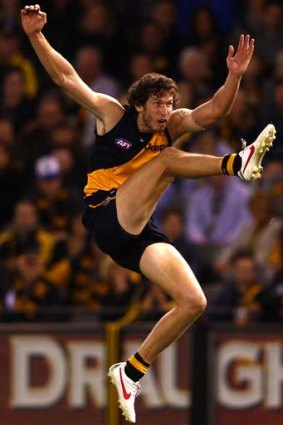 Tiger Ty Vickery kicks for goal during Richmond's fourth defeat, this against the Eagles.