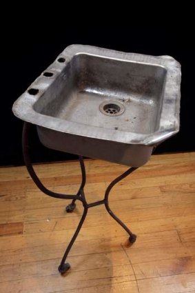 A kitchen sink on a tripod found in a lane and the full suite.