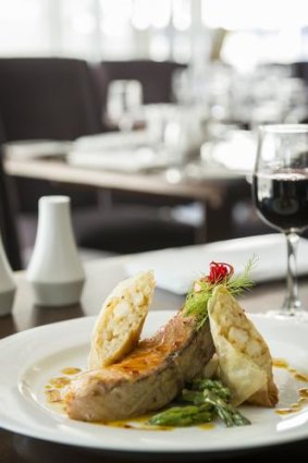 Chargrilled Tasmanian salmon, with prawn spring roll, steamed asparagus, and orange and chilli glaze.