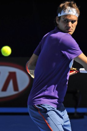 No injury concerns … Roger Federer practises at Melbourne Park yesterday. He withdrew from this week's Kooyong Classic after a hectic schedule and to be with his family.