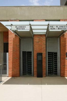Separated entrances are simulated for coloured and white people at the Apartheid Museum, Johannesburg.