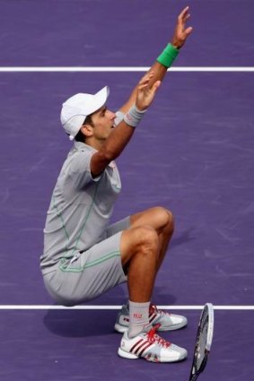 Novak Djokovic celebrates winning in straight sets against Rafael Nadal.