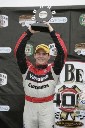 Past glory: Lee Holdsworth holds the trophy aloft after winning the Jim Beam 400 in 2007.