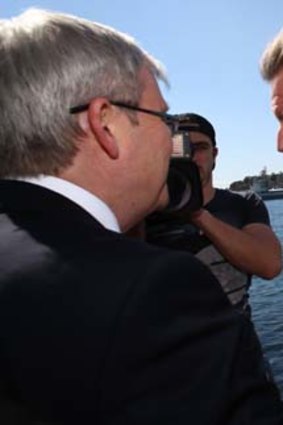 On the trail: Rudd is confronted by Barry O'Farrell.