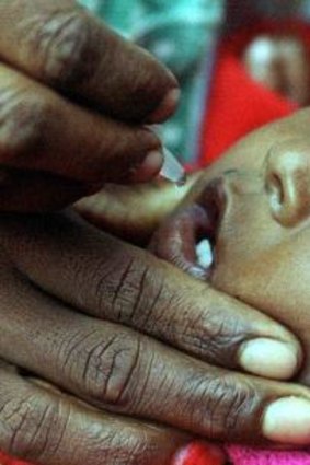 Polio-free nation: An Indian health worker administers oral polio vaccine to a baby during a programme against the crippling disease in New Delhi.