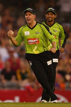 At last: Mike Hussey celebrates a wicket.