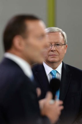 The Comeback kid: Kevin Rudd watches opposition leader Tony Abbott.