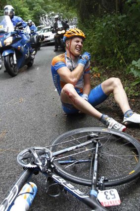 Tyler Farrar of the USA grimaces in pain after crashing.