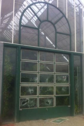 Vandals smashed windows in the gardens' glass house.