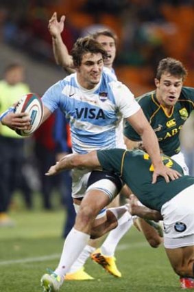 South Africa's Patrick Lambie (R) challenges Argentina's Pablo Matera during the Rugby Championship test match at the soccer city stadium in Soweto.