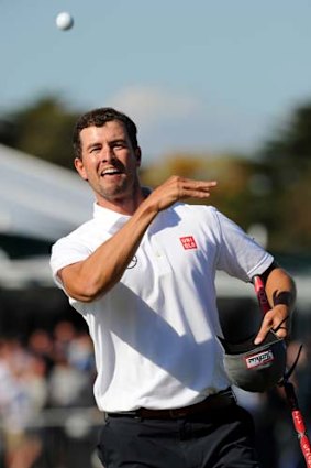 Adam Scott throws the ball to the crowd after winning the Masters.