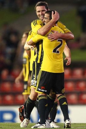 On the rise: Manny Muscat and Tim Brown celebrate a Phoenix win.