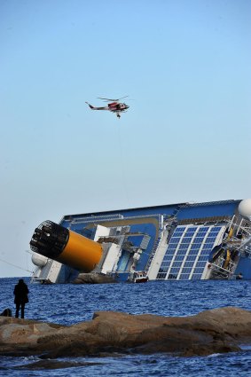 A helicopter evacuates Marrico Giempietroni, the Costa Concordia's cabin service director.