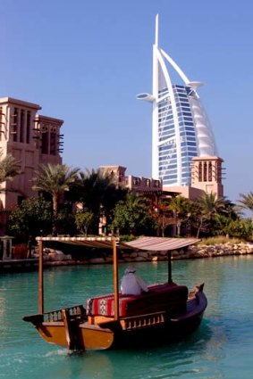 A boat on the canal by the Burj al Arab hotel.