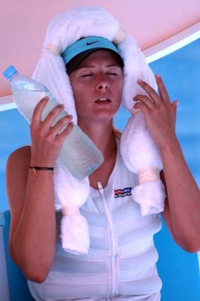 Temperature tantrums: Maria Sharapova on a break in her match against Karin Knapp.