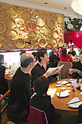 <p>A sleek interior complements state-of-the-art dumpling production at Din Tai Fung's Sydney Outlet.</p>