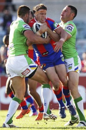 No way through: Knights captain Kurt Gidley found it hard to penetrate the Raiders' defence.