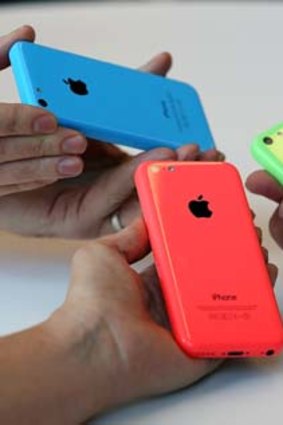 CUPERTINO, CA - SEPTEMBER 10: The new iPhone 5C is displayed during an Apple product announcement at the Apple campus on September 10, 2013 in Cupertino, California. The company launched the new iPhone 5C model that will run iOS 7 is made from hard-coated polycarbonate and comes in various colors and the iPhone 5S that features fingerprint recognition security.   Justin Sullivan/Getty Images/AFP