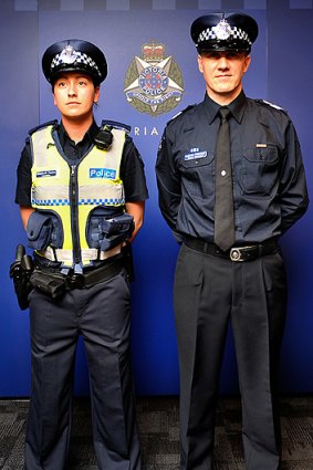 Constable Elizabeth Tonkin and Senior Sergeant Andrew Falconer model the new navy blue Victoria Police uniforms.