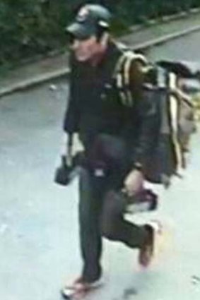 A man identified by police as Iranian bomb suspect Saeid Moradi is seen in Bangkok, Thailand, carrying grenades which blew off his own legs and wounded four civilians.