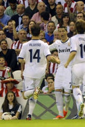Real Madrid players celebrating a goal against Athletic Bilbao.