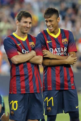 Lionel Messi shares a joke with Neymar.