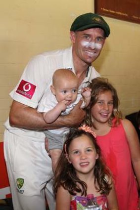 Michael Hussey with his children after retiring.
