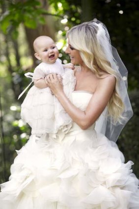 Roxy Jacenko in her wedding dress with her baby Pixie-Rose.