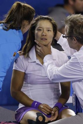 Concussion check &#8230; Li Na is treated after falling following the fireworks break.