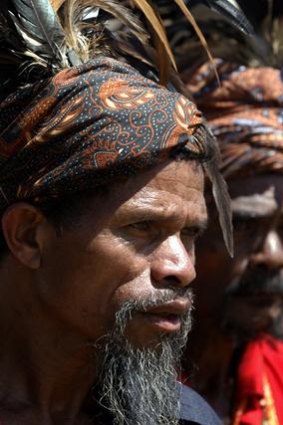 East Timorese men wearing traditional dress.