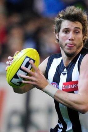 Magpie Dale Thomas. The man for Matt Priddis when the Eagle is on the ball.