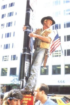 Tall order: Paul Hogan climbs a New York lamp post in a scene from <i>Crocodile Dundee</i>.