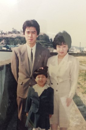 The only photo of the Naritas and their daughter Emi not destroyed in the tsunami.