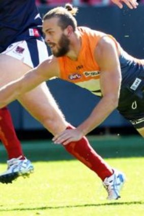 Down and out: GWS Giants defender Tim Mohr.