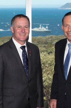 New Zealand Prime Minister John Key and Austrralian Prime Minister Tony Abbott at the opening of the National ANZAC Museum, with the commemorative fleet in the background.
