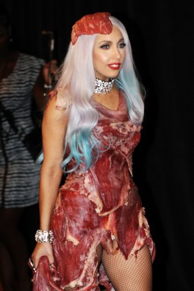 Lady Gaga wears her controversial meat dress, as she arrives in the Press Room after winning eight 2010 MTV Video Music Awards.