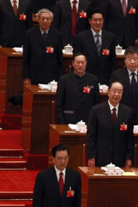Chinese Premier Wen Jiabao (right) and President Hu Jintao stand to sing the national anthem at the congress yesterday.