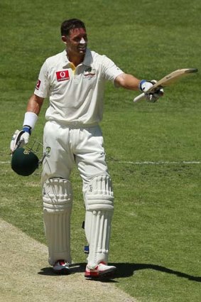 Mike Hussey acknowledges the crowd after notching his century.