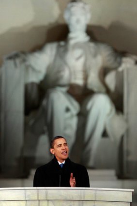 Mr Obama addresses the crowd from in front of the Lincoln Memorial.
