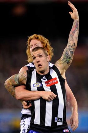 Dane Swan and Cameron Ling in the 2011 grand final.