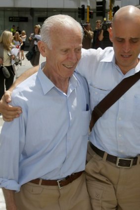 Harry Nicolaides embraces his father Socrates.