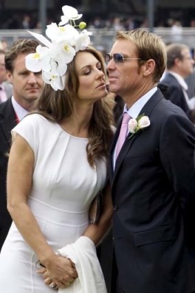 Kiss and sell &#8230; Liz Hurley and Shane Warne at the races.